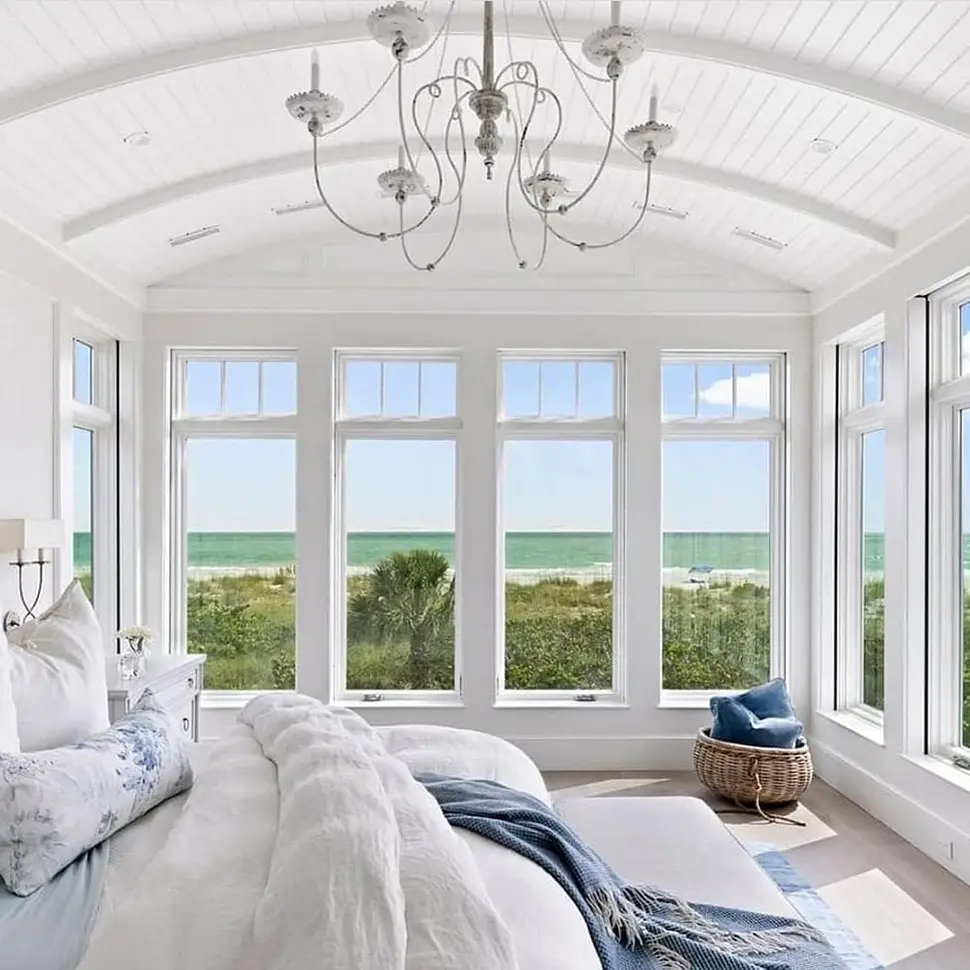 Hamptons style bedroom with soft neutral palette, timber bed head and natural textures